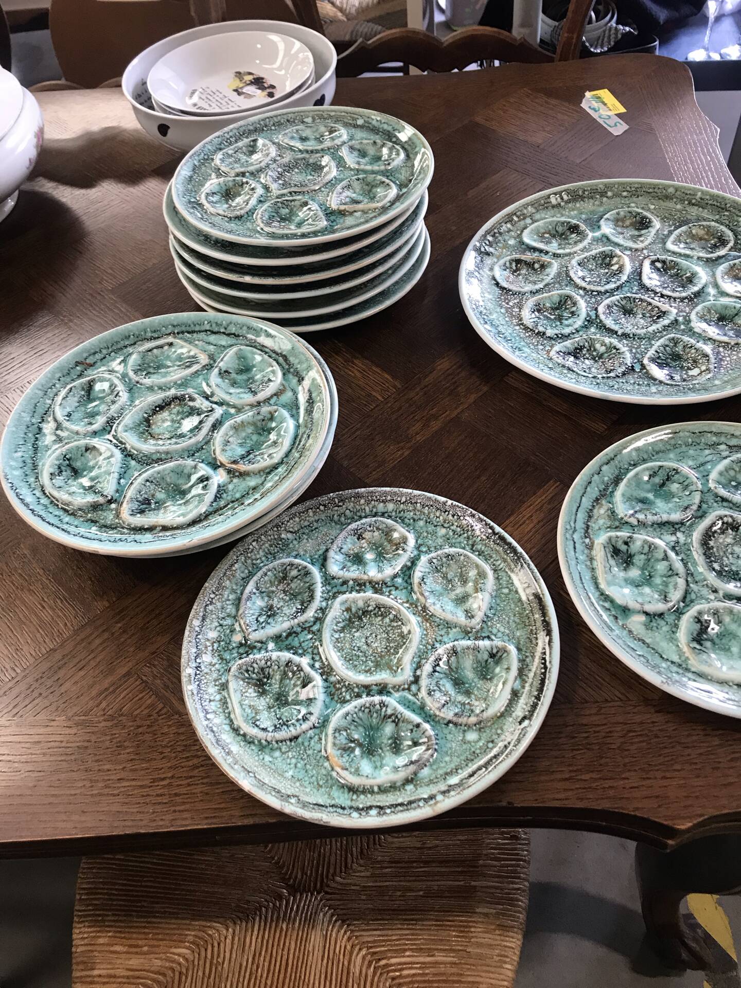Set of 12 plates and an oyster dish or other in majolica.