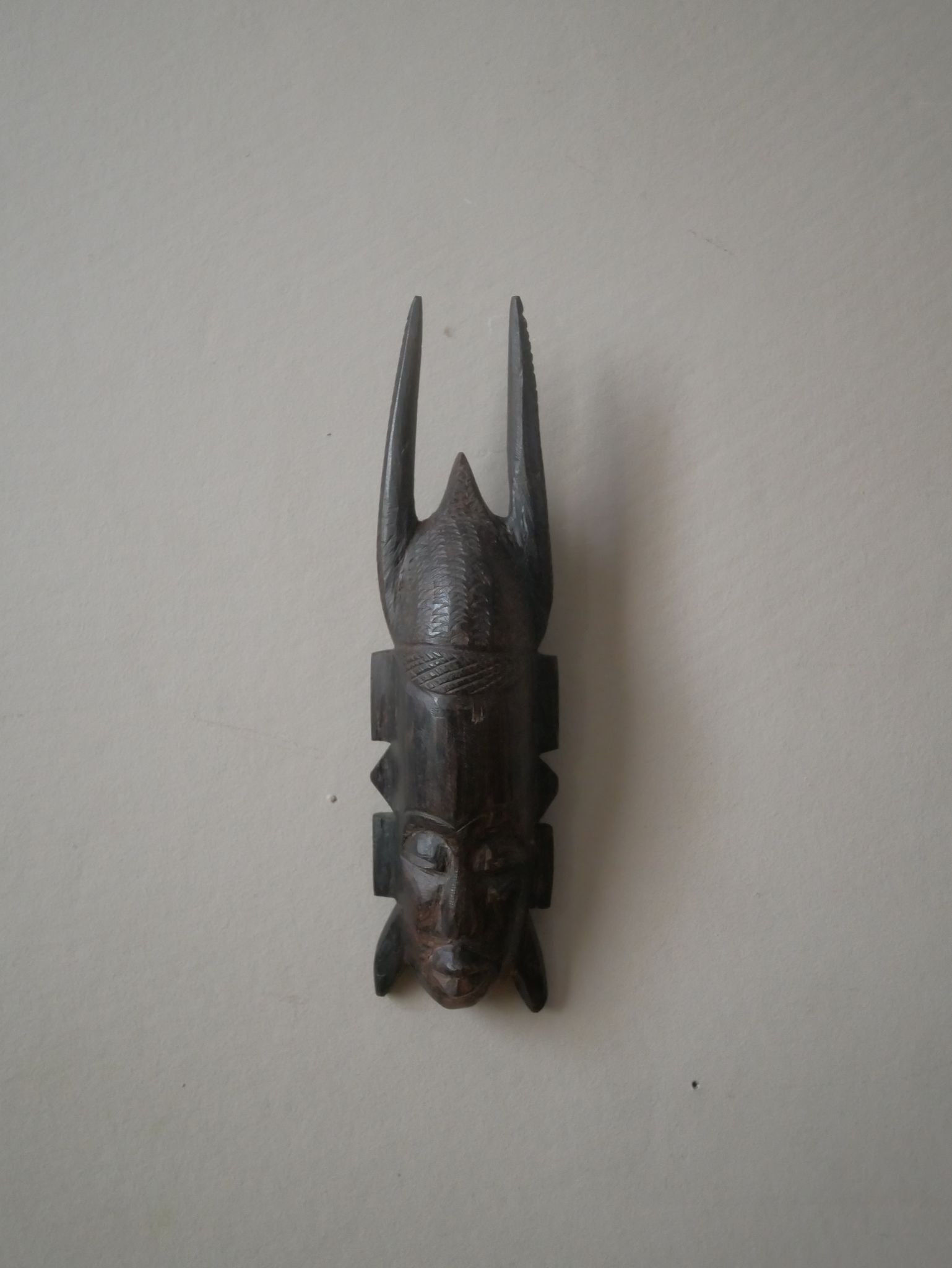 Carved wooden mask, vintage tribal decoration object, African art