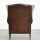 Cowhide wingback armchair in English style finished with decorative nails