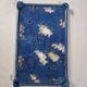 Blue cast iron trivet with flowers, small chip in the paint otherwise very good.