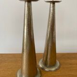Pair of hammered metal candlesticks