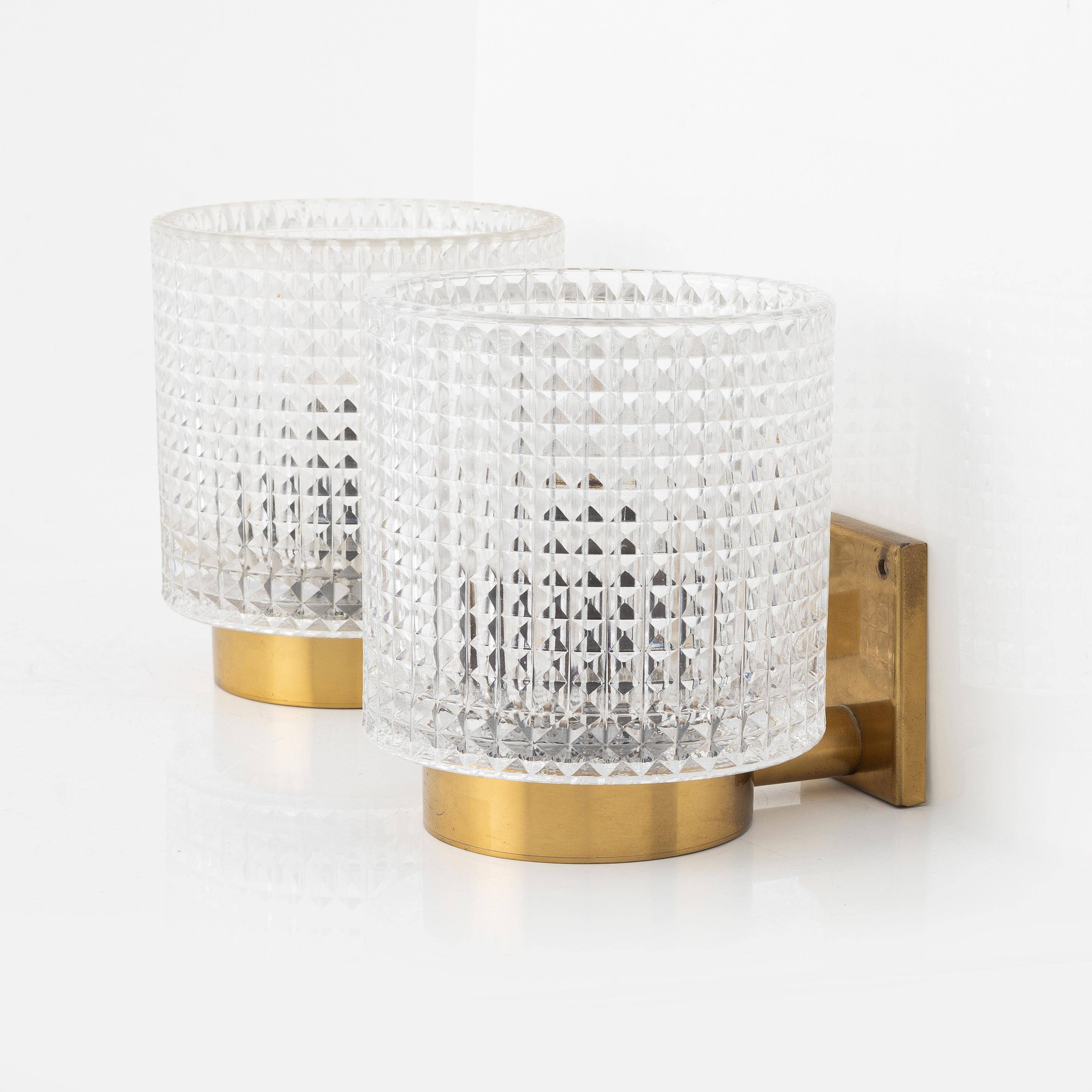 Carl Fagerlund for Orrefors Pair of wall lights in brass and glass Sweden 1960