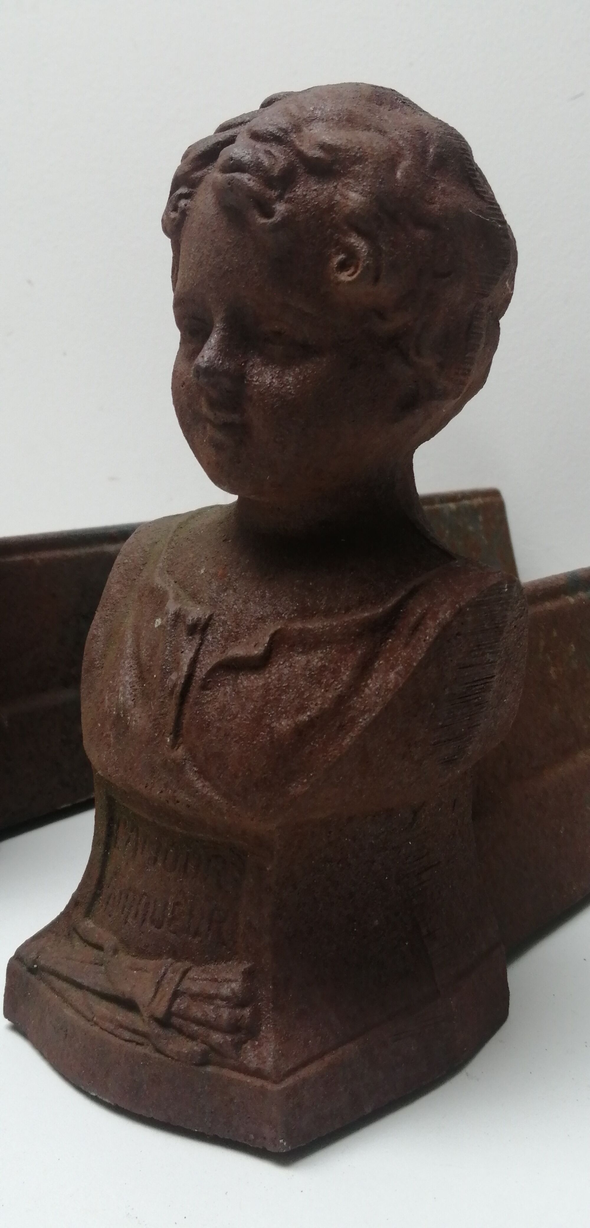 Pair of cast iron fireplace chenets "children"