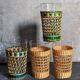 Four long drink glasses in vintage woven rattan cases