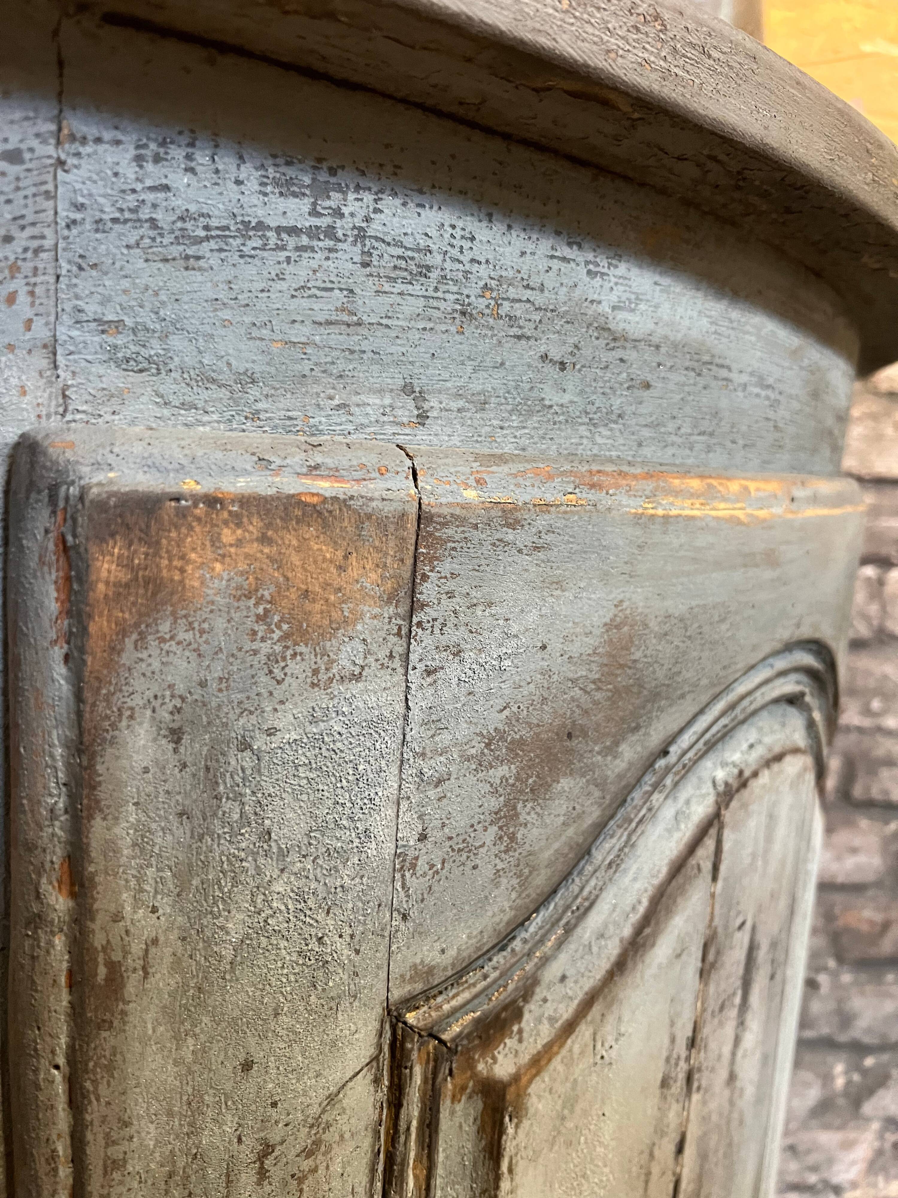Eighteenth-century corner cabinet with a patina.