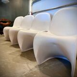 4 white Panton style armchairs