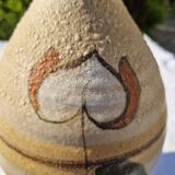 Handcrafted jug or jar with a handle, terracotta pottery vase, fat lava effect, stylized flowers