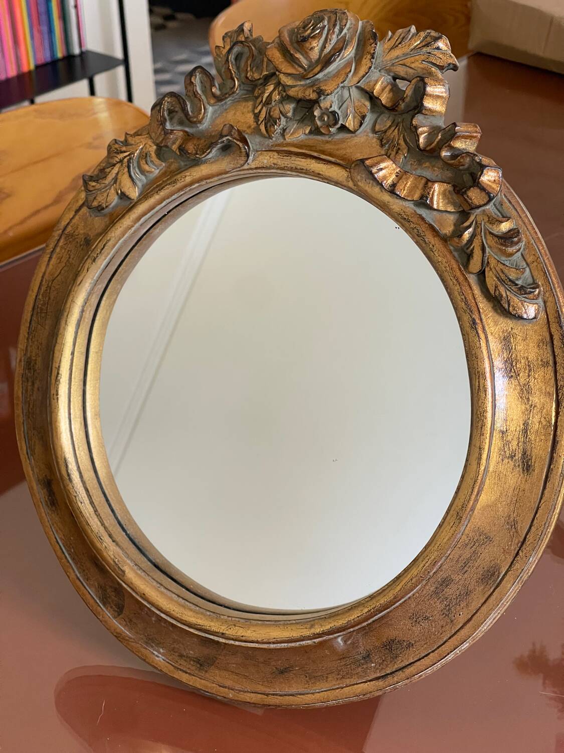 Round carved wooden mirror