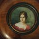 Miniature painting portrait of a woman with a red bodice