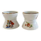 2 porcelain diabolo egg cups. 1 children's pattern and 1 flower pattern. In a perfect state.