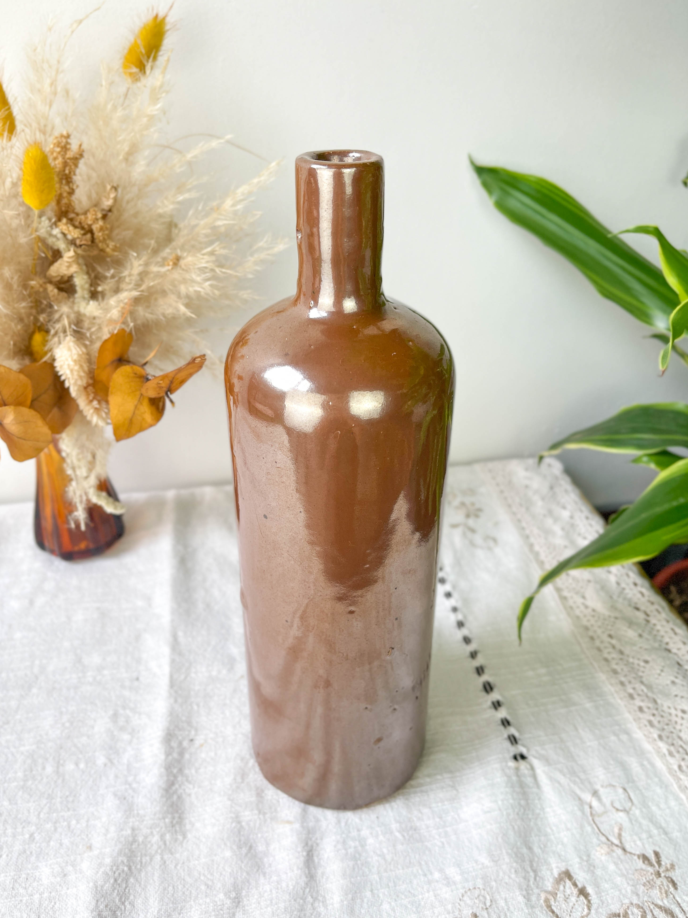 Vintage iridescent brown stoneware bottle