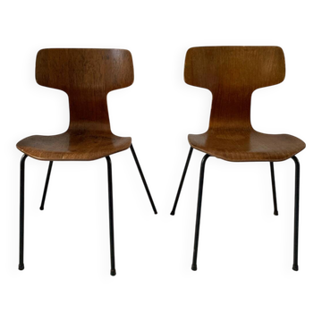 Two "Hammer" chairs by Arne Jacobsen.