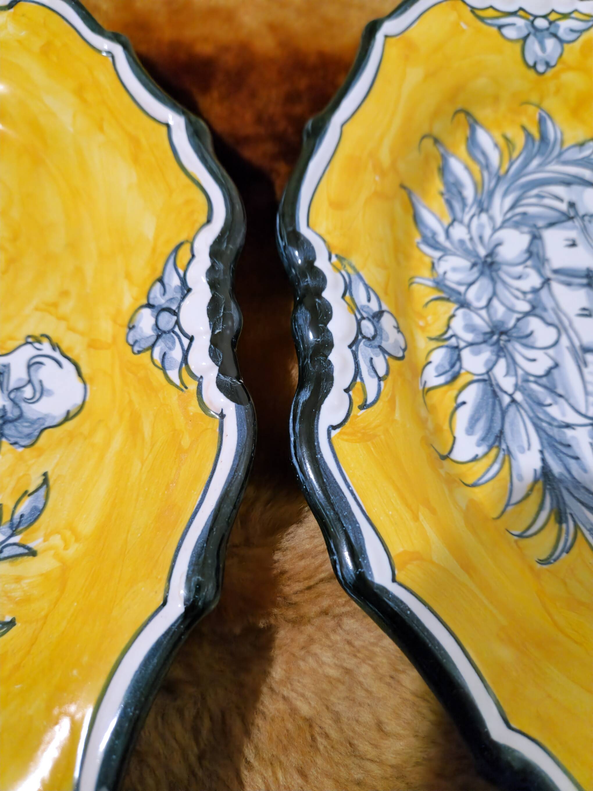 Pair of oval dishes in hand-painted faience with an Italian majolica spirit.