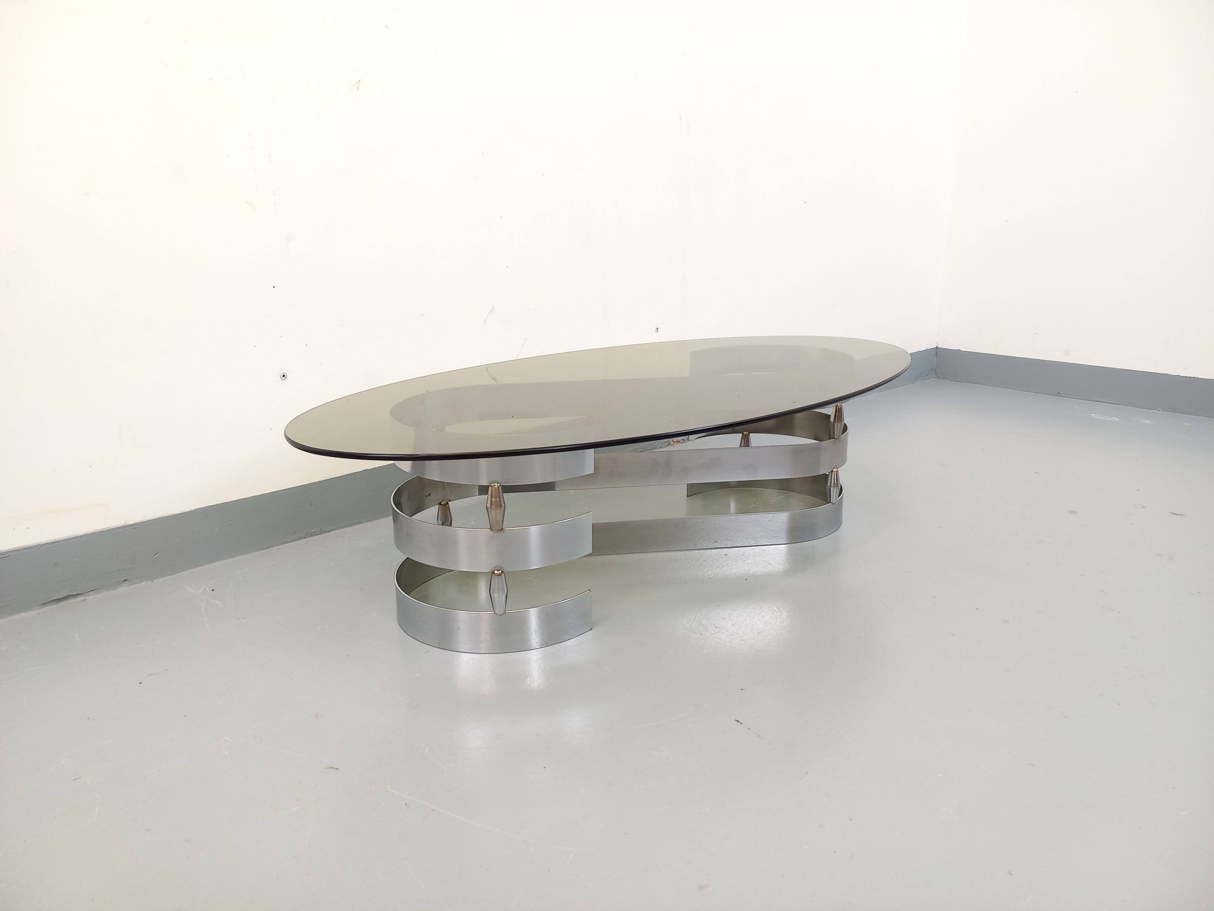 Vintage oval coffee table in smoked glass and chrome metal from the 1970s.