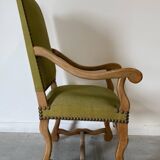 Olive green upholstered armchairs with studs