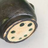 Incised glazed earth pitcher