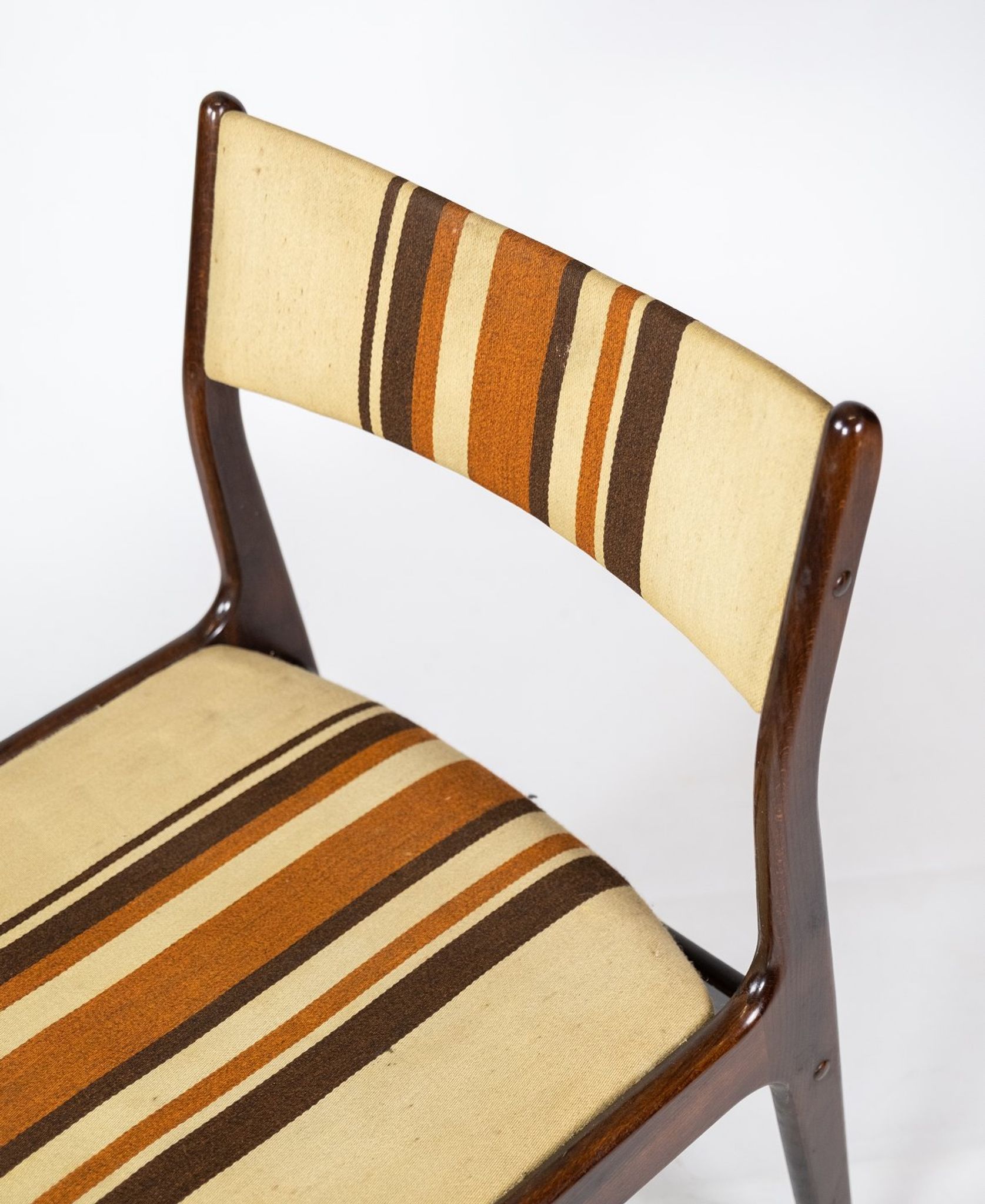 Pair of chairs in dark wood upholstered with light striped fabric of danish design