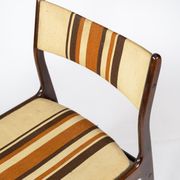 Pair of chairs in dark wood upholstered with light striped fabric of danish design