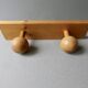 Wall coat rack with 2 pine ball hooks
