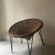 Italian sunflowers armchair in rattan and black metal, 1950s design.