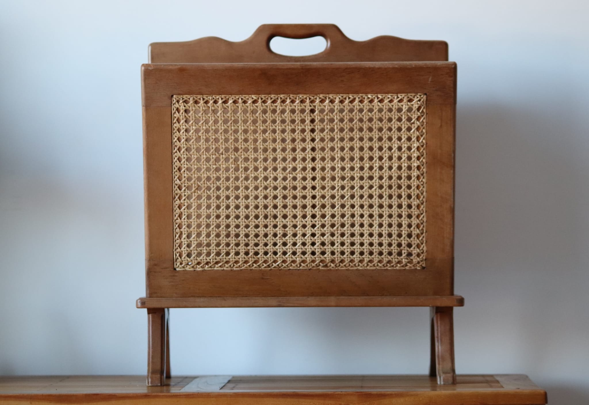 Wooden magazine holder and vintage cannage