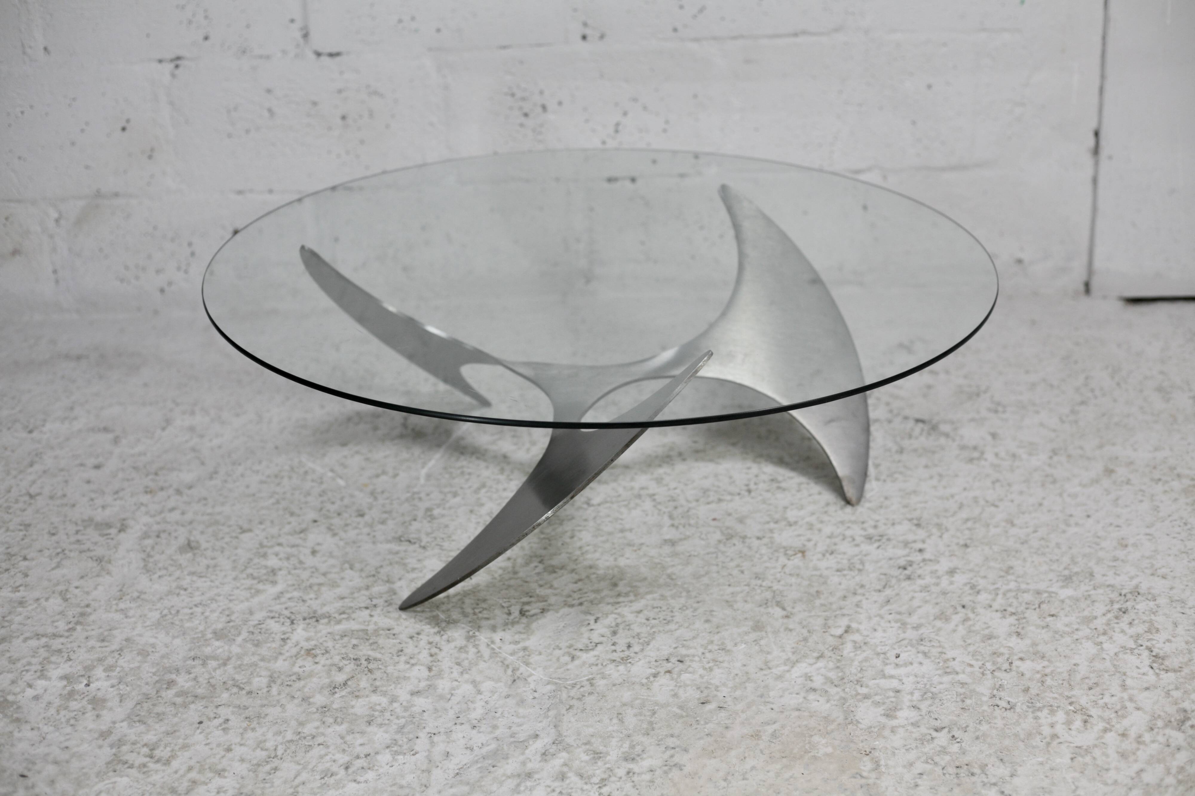 "space age" coffee table. Steel legs, glass slab. Circa 1970