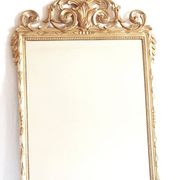 Golden mirror in the Louis XVI style from the 20th century.