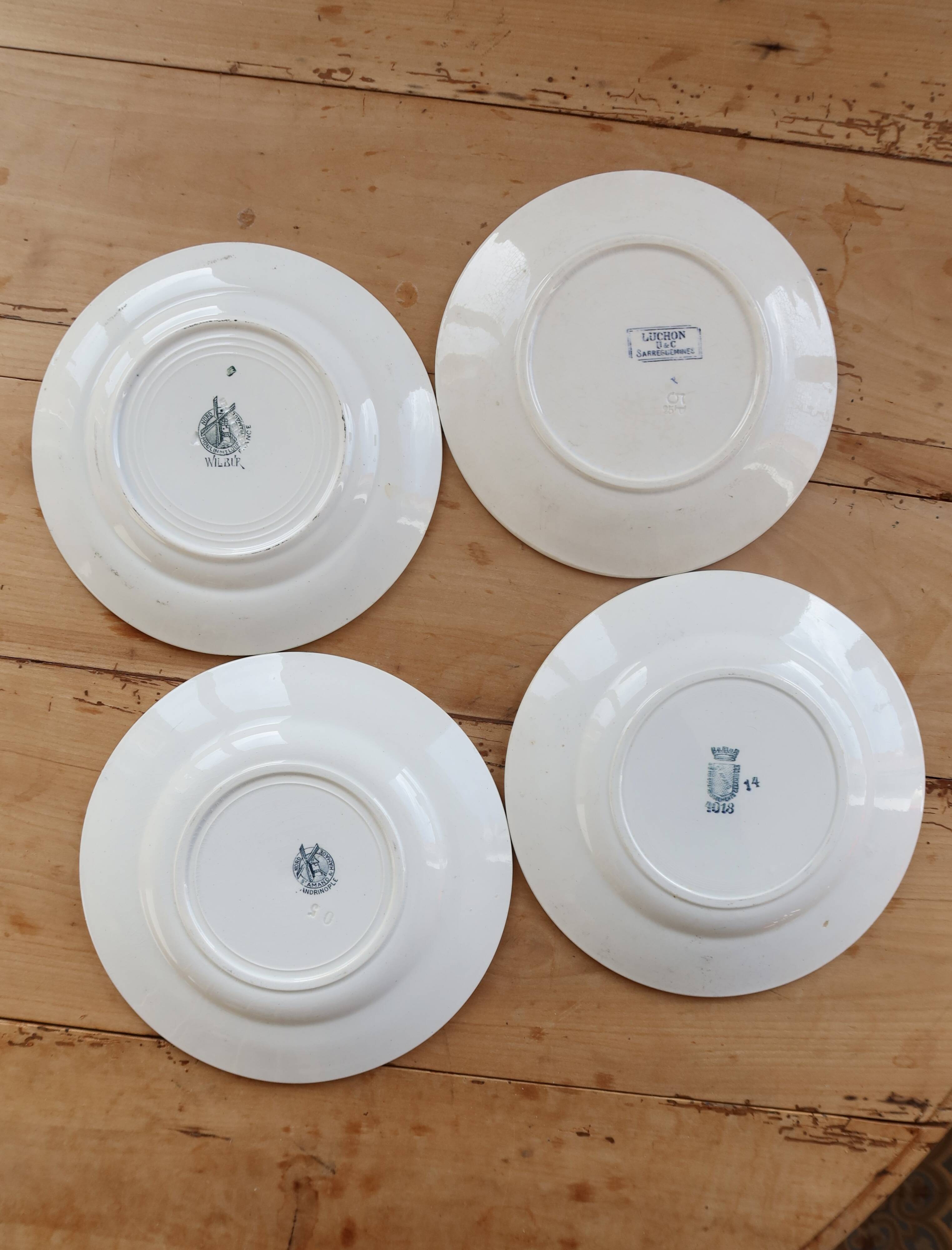 Mismatched vintage flat plates in green and blue ironstone.