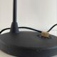 Lampe de table Tom Dixon modèle "Beat Table Light" en métal noir et laiton