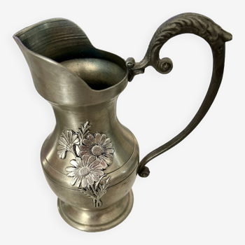 Old pitcher in real Pewter with floral decoration.