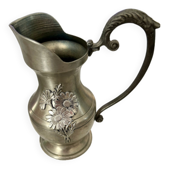 Old pitcher in real Pewter with floral decoration.