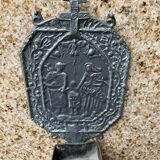 Small wall-mounted holy water font