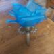Art Deco style wall light in frosted blue glass with silver metal support.