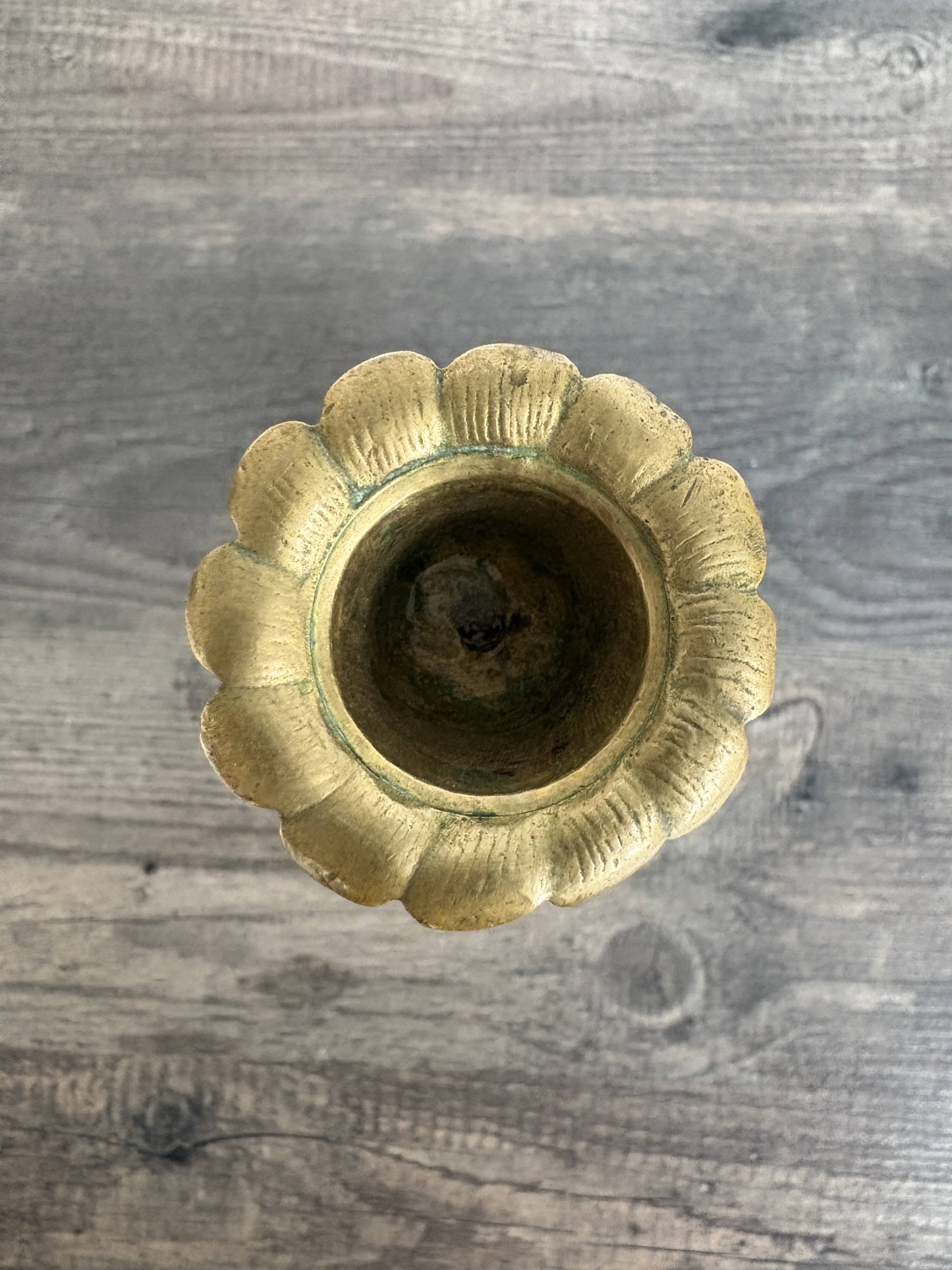 Antique chiselled bronze candlestick