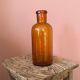 Amber glass bottle vase