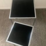 Pair of nesting tables in chromed metal and glass