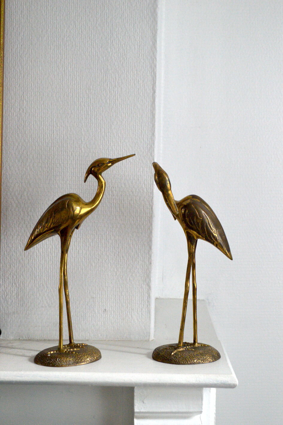 Brass herons couple