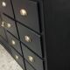 One-door workshop unit with eight black and gold drawers
