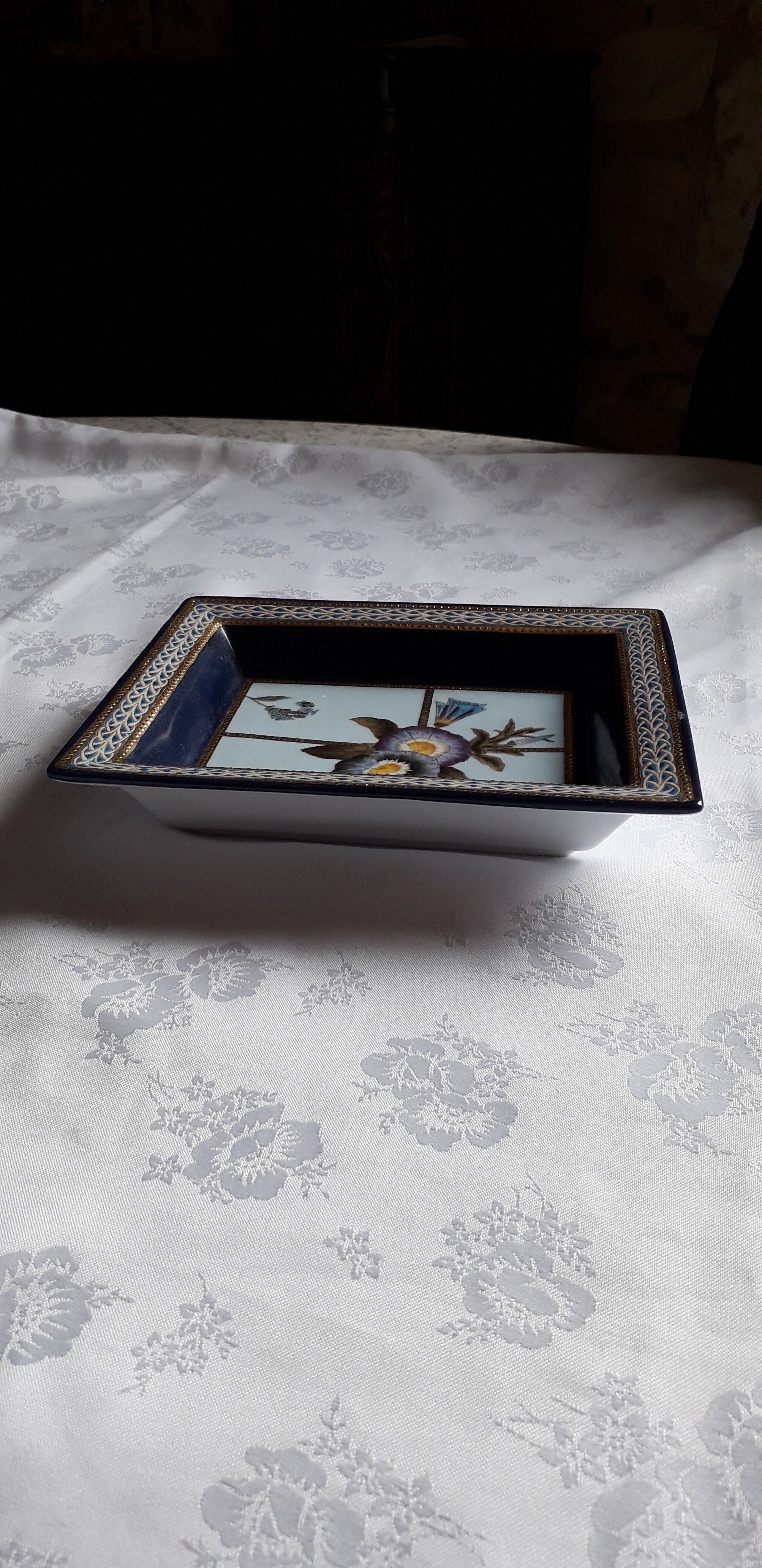 Empty cut painted porcelain pockets by designer Régis Dho