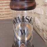 Vintage glass and wood whiskey bottle with pouring tap