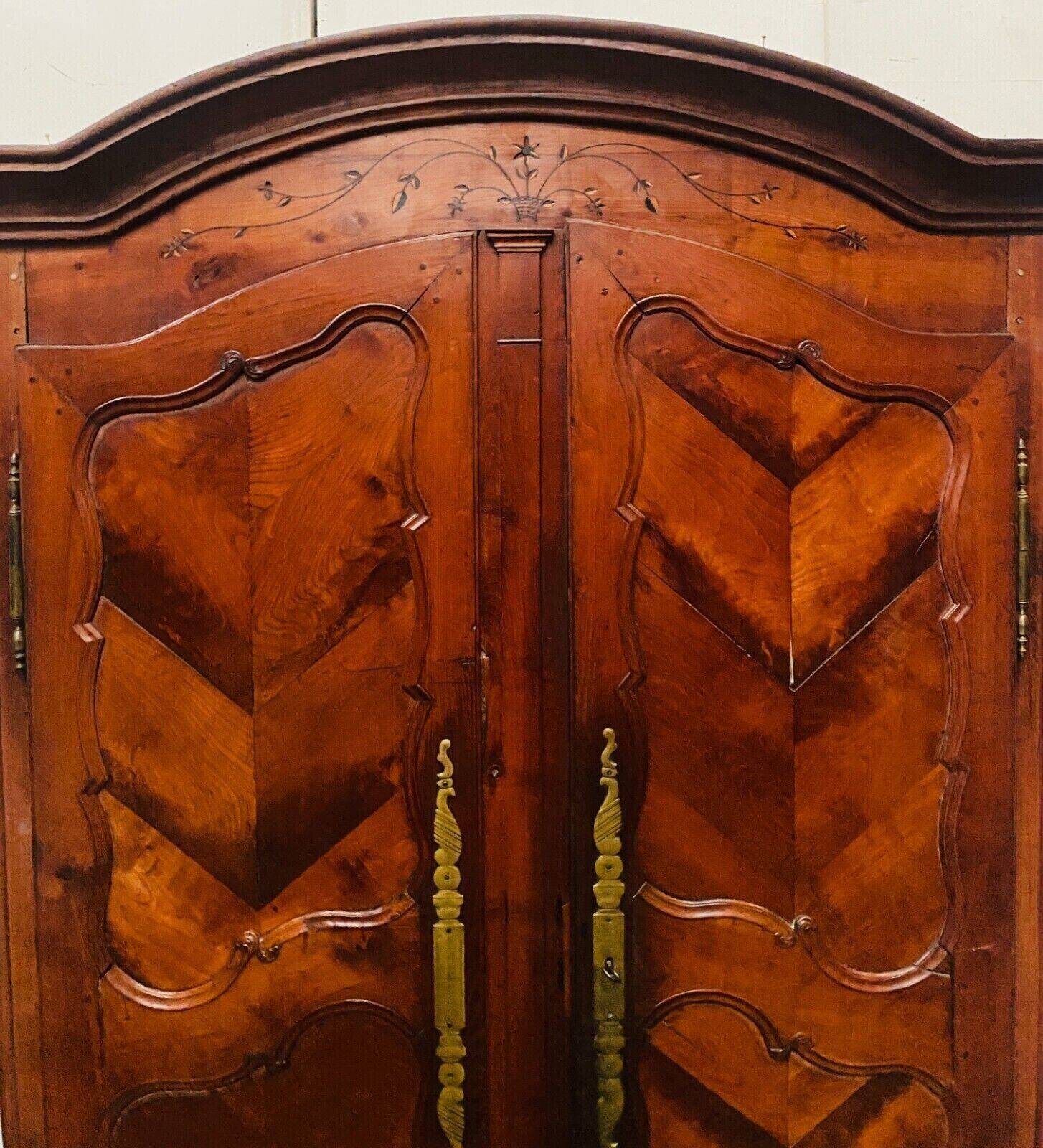 Louis XV armoire with gendarme's hat in solid cherry wood, 18th century