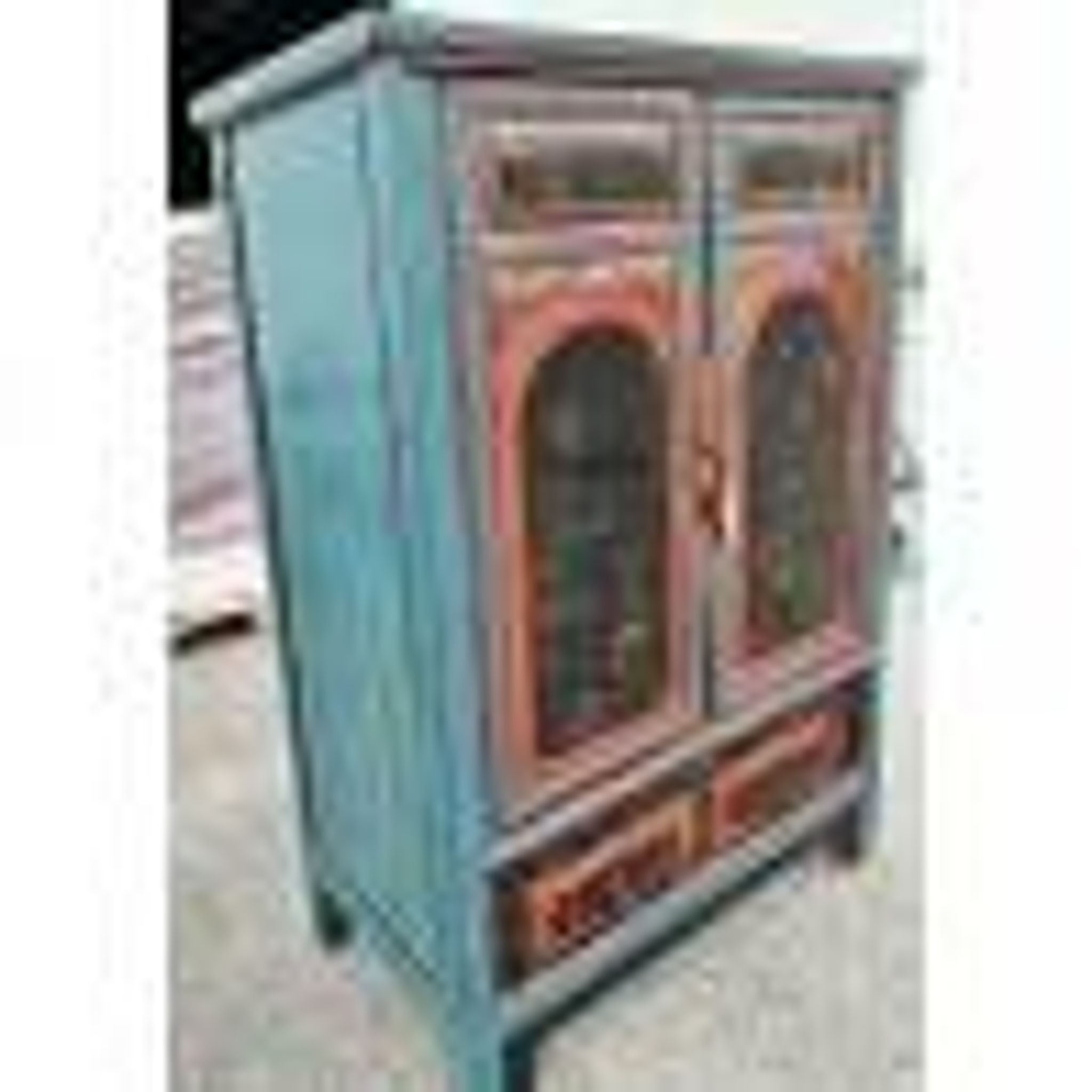 Restored antique Vietnamese wardrobe with care.