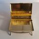Beautiful art deco cigarette box in gold metal
