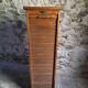 French antique wardrobe with curtain in oak, circa 1920–1930.