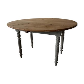 Round wooden table with flaps