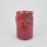 Red glazed ceramic jug with relief
