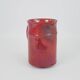 Red glazed ceramic jug with relief