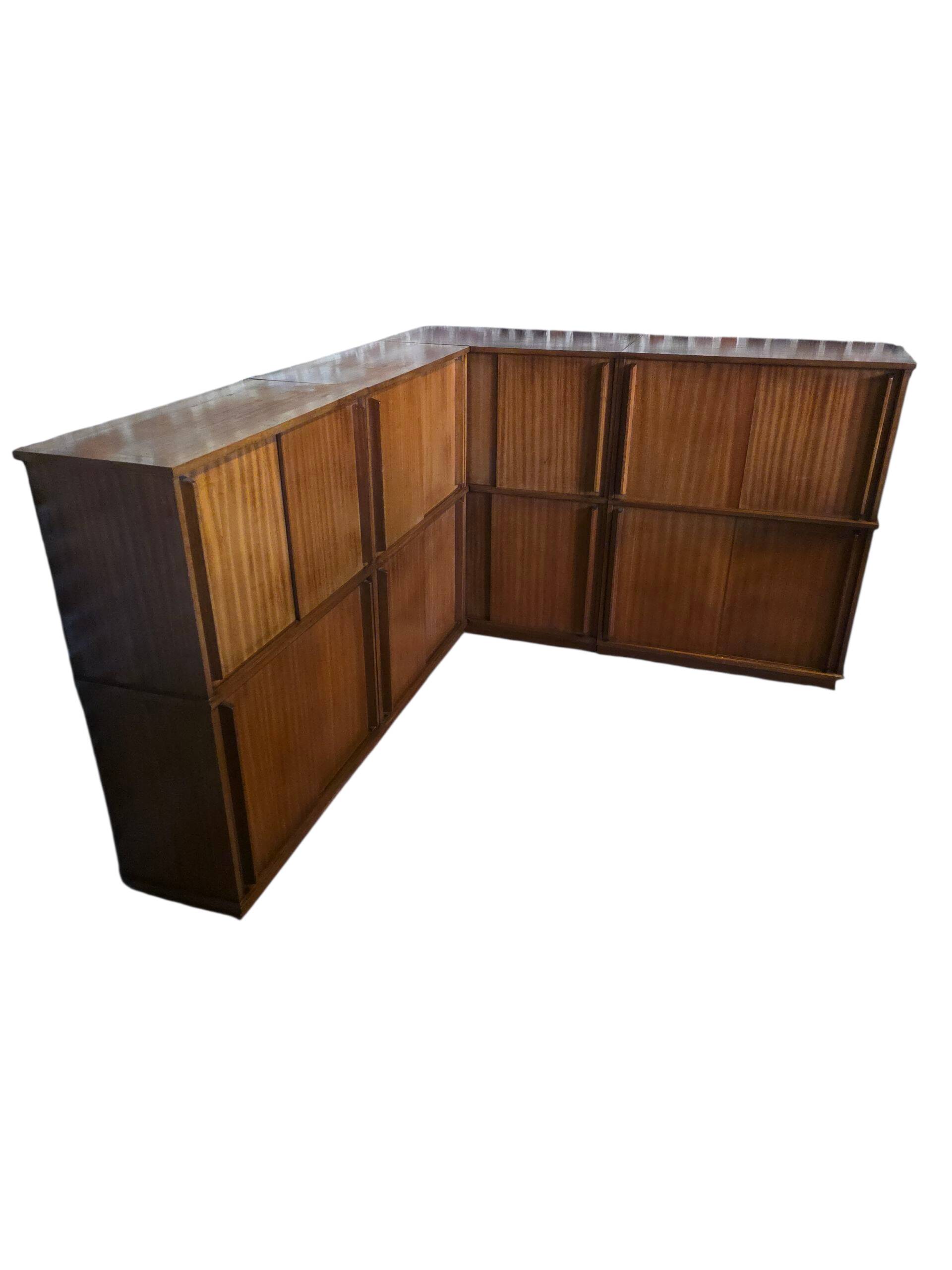 Modular corner library Oscar from the 1960s with sliding doors.