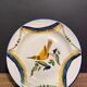 Large earthenware dish signed with bird decoration