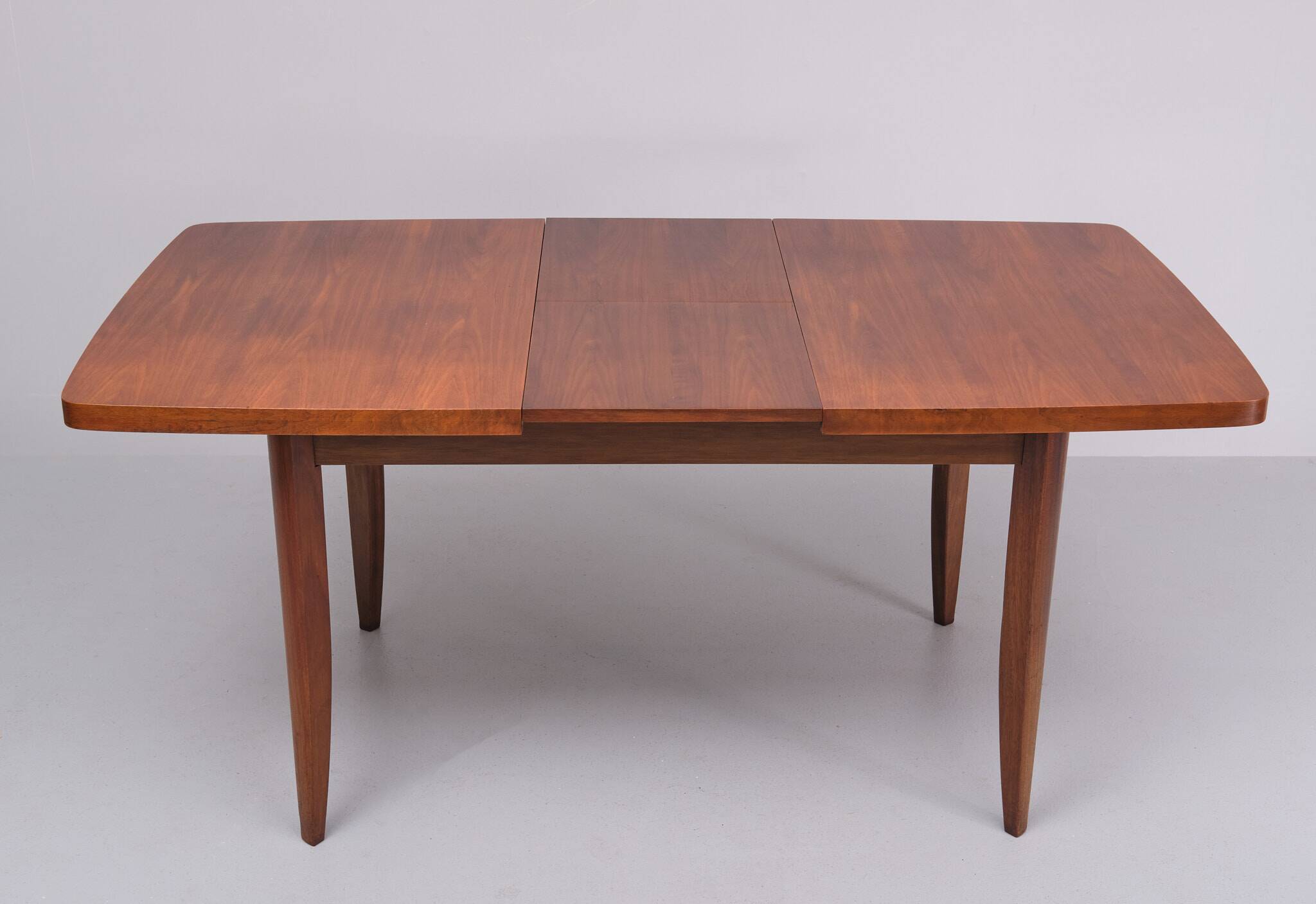 Extendable dining table in walnut wood by Jindrich Halabala 1960